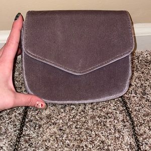 Anthropologie purse. Small size, long chain and wrist clutch. Grayish purple